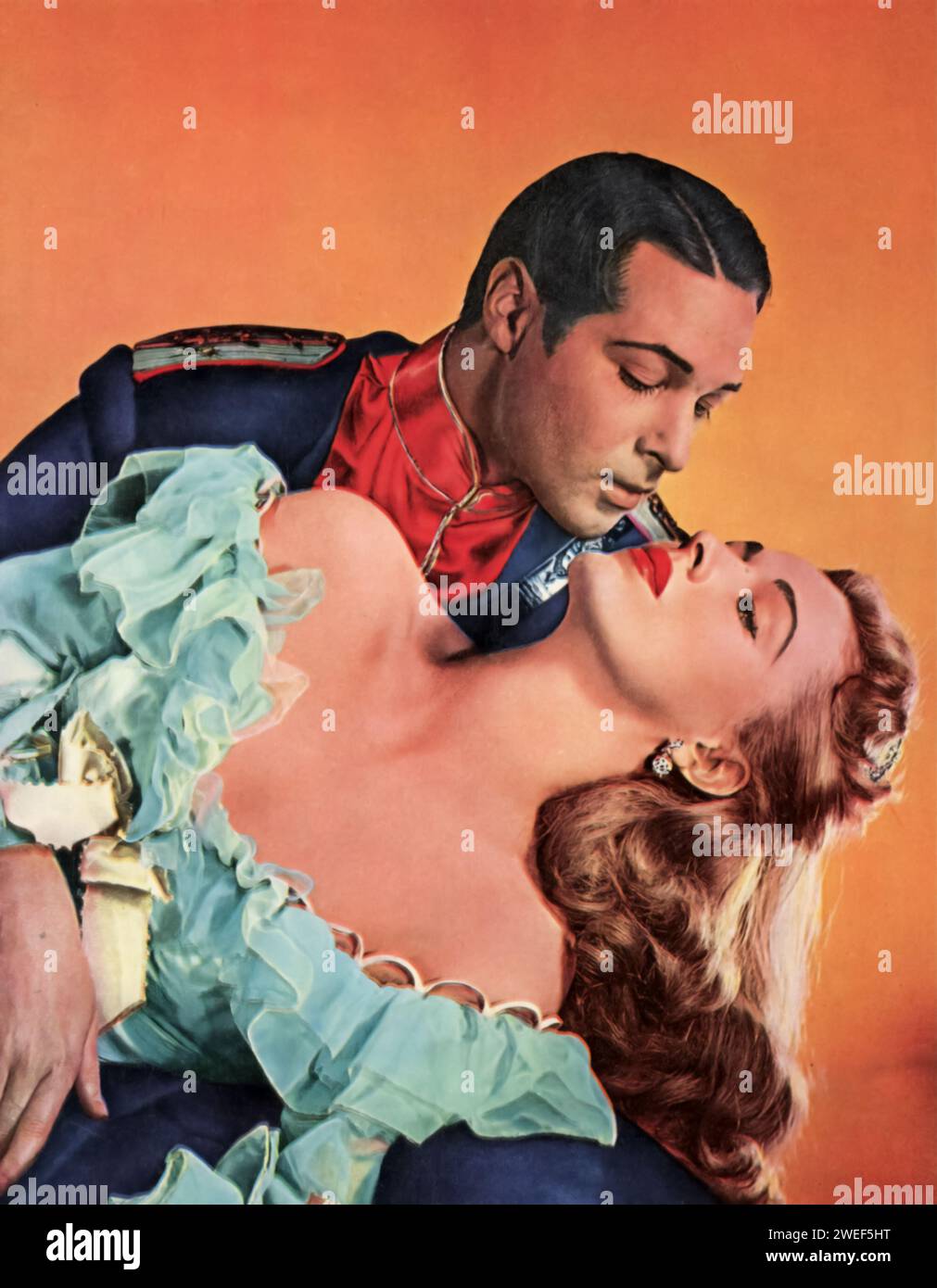 Ein Porträt des Schauspielers Anthony Dexter und der Schauspielerin Eleanor Parker, Stars des Films Valentino (1951). In diesem biografischen Drama stellt Dexter Rudolph Valentino, die legendäre Stummfilmikone, dar, die das Charisma und die Komplexität des berühmten Schauspielers einfängt. Parker spielt Joan Carlisle, ein fiktionales Amalgam mehrerer Frauen in Valentinos Leben, das einen Einblick in die persönlichen und beruflichen Herausforderungen bietet, denen der Star gegenübersteht. Stockfoto