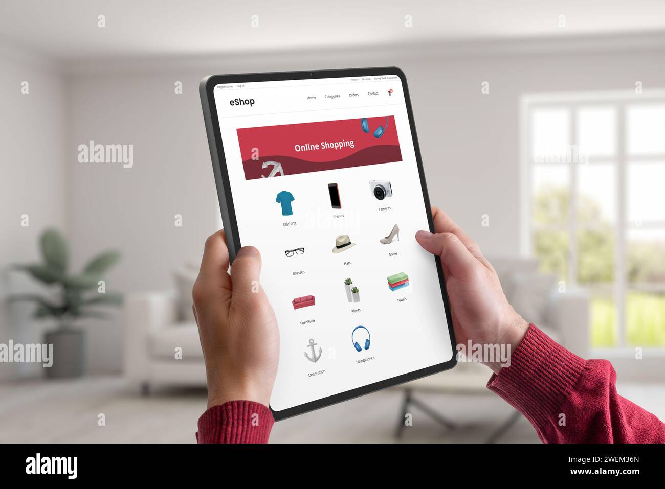 Halten Sie ein Tablet, das eine E-Commerce-Webseite mit Produktkategorien anzeigt. Konzept des bequemen Online-Shoppings von zu Hause aus, das nahtlose und Stockfoto