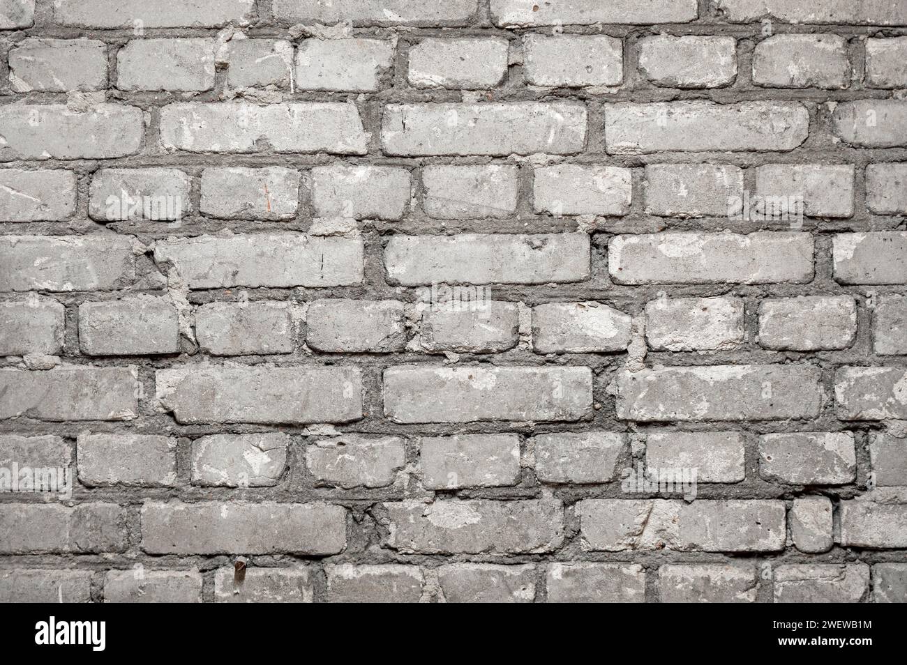 Nahaufnahme einer flachen Ziegelwand mit Reihen von Zementbetonziegeln als Hintergrund Stockfoto