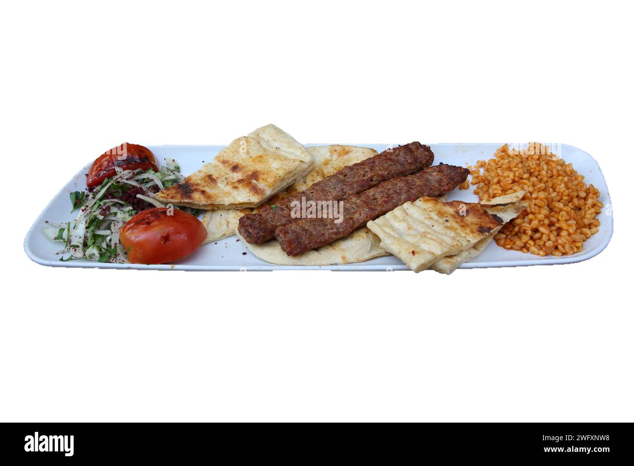 Traditioneller türkischer Hackfleischkebab, Adana Kebab, isoliert auf weißem Hintergrund Stockfoto