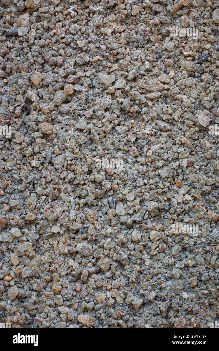 Nahaufnahme von Sand und Zementmischung körnige Betonwandfläche, Betonmischung aus zu viel Sand oder zu wenig Zement, abstrakt Stockfoto