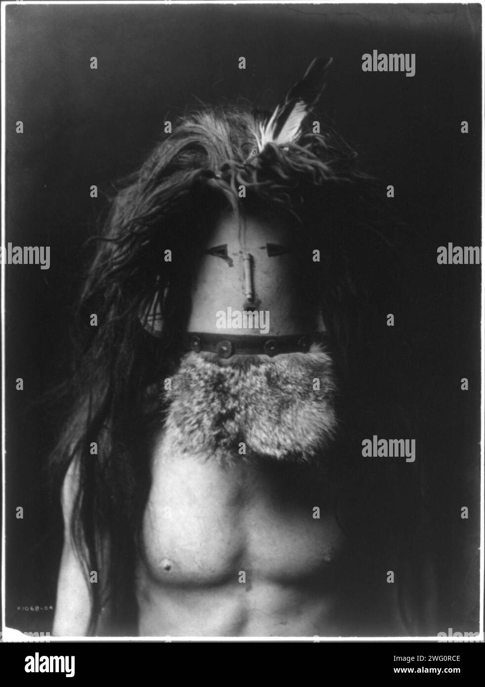Haschebaad-Navaho, 1905. Der barmherzige Navajo-Mann trägt die Maske von Haschebaad, einer wohlwollenden weiblichen Gottheit. Stockfoto