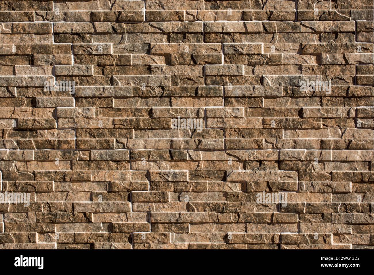 Steinwandfläche als einfaches Hintergrundstrukturmuster Stockfoto