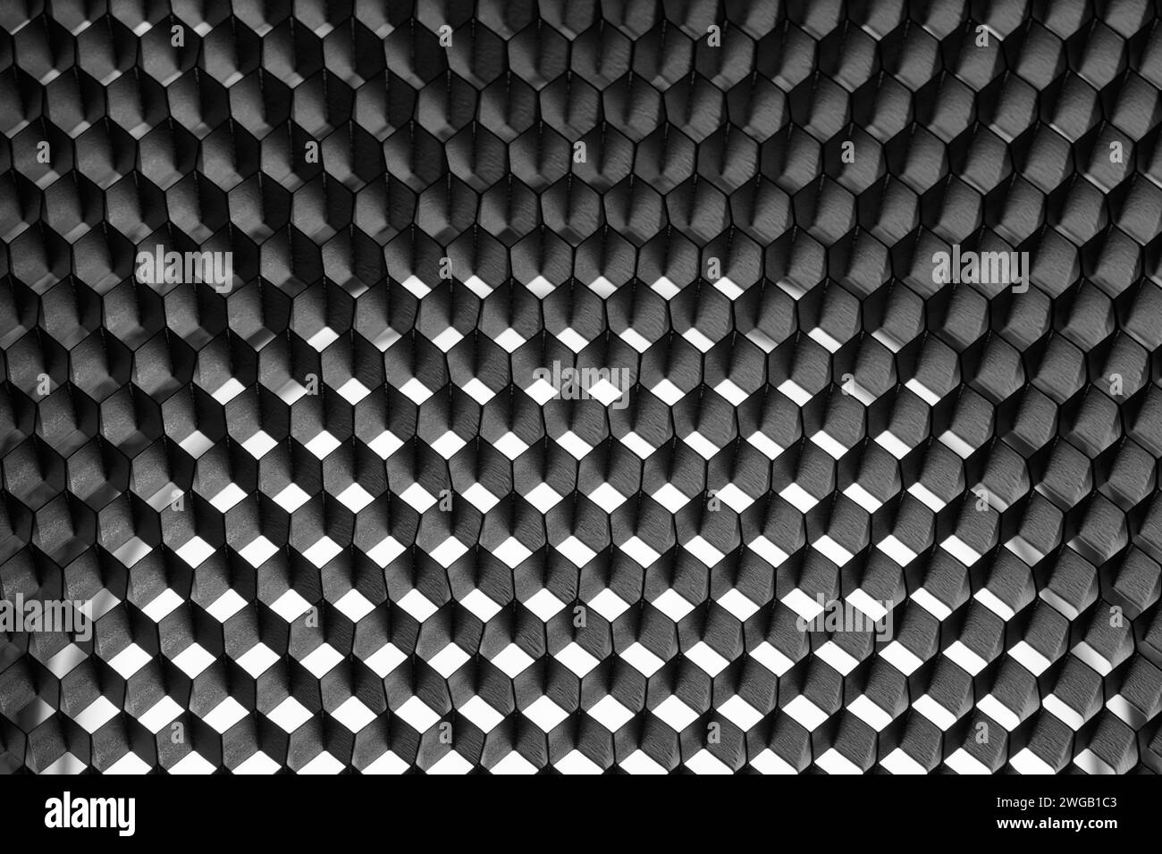 Abstrakter grauer Hintergrund mit Wabenzellen, hintergrundbeleuchtet mit einem Halbkreis in der Mitte. Fotografischer Wabenreflektor. Stockfoto