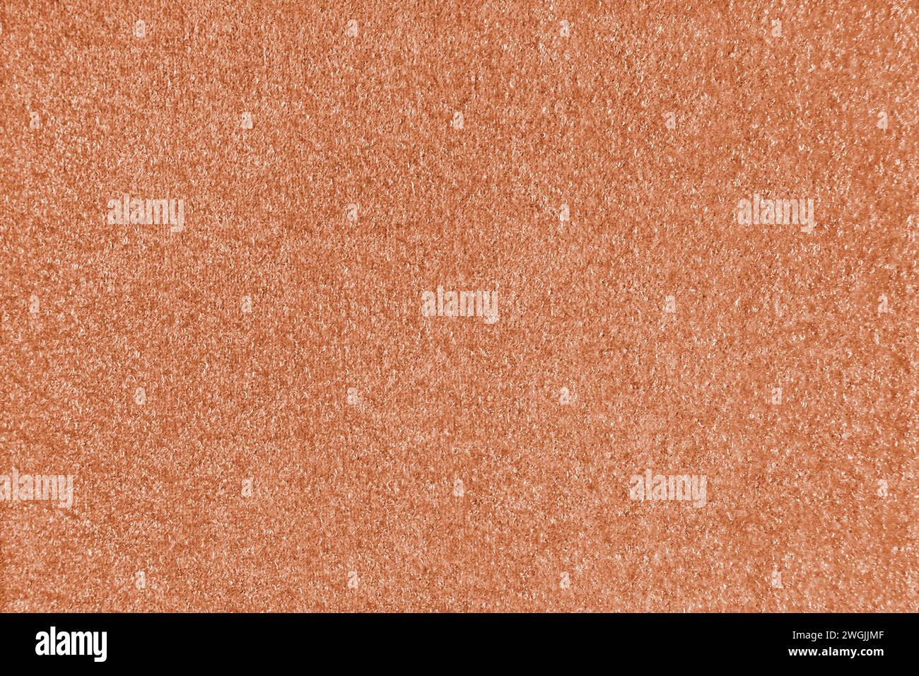 Texturhintergrund aus orangefarbenem Stoff. Polster mit Jacquard-Textur, boucle-Möbel, Textilmaterial, Design-Inneneinrichtung, Einrichtung. Ridge-Textur Stockfoto