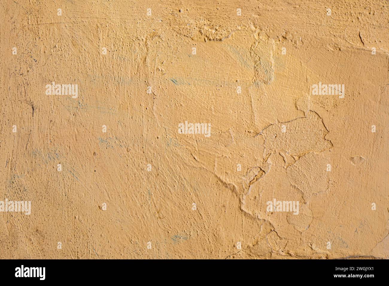 Orangefarbene, bemalte Stuckwand, Hintergrund Stockfoto
