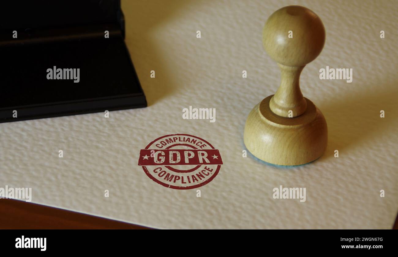 DSGVO Compliance Stempel und Stempelhand. Allgemeines Konzept der Datenschutzregelung. Stockfoto