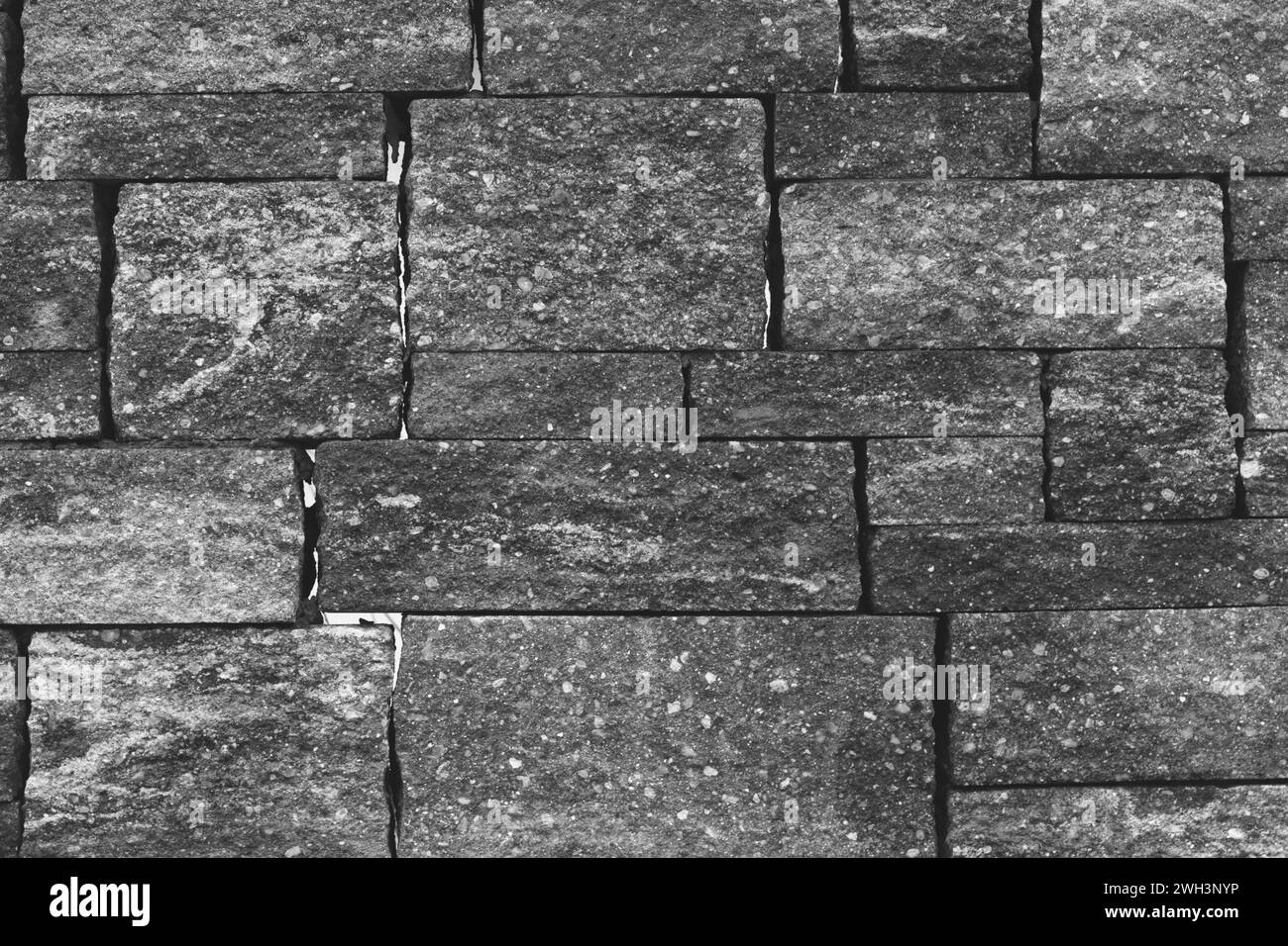 Steinmauer mit quadratischen Steinen Stockfoto