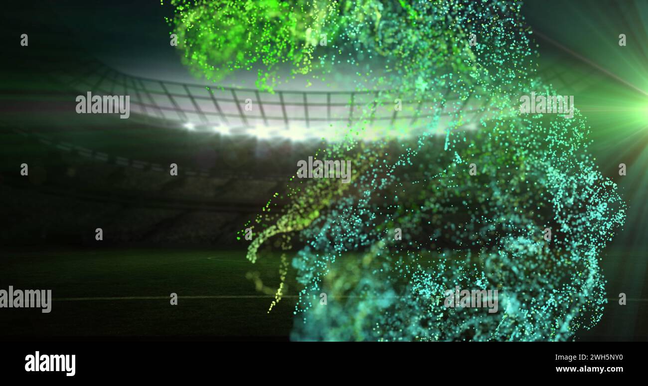 Bild von grünen Partikeln, die sich über das Sportstadion bewegen Stockfoto