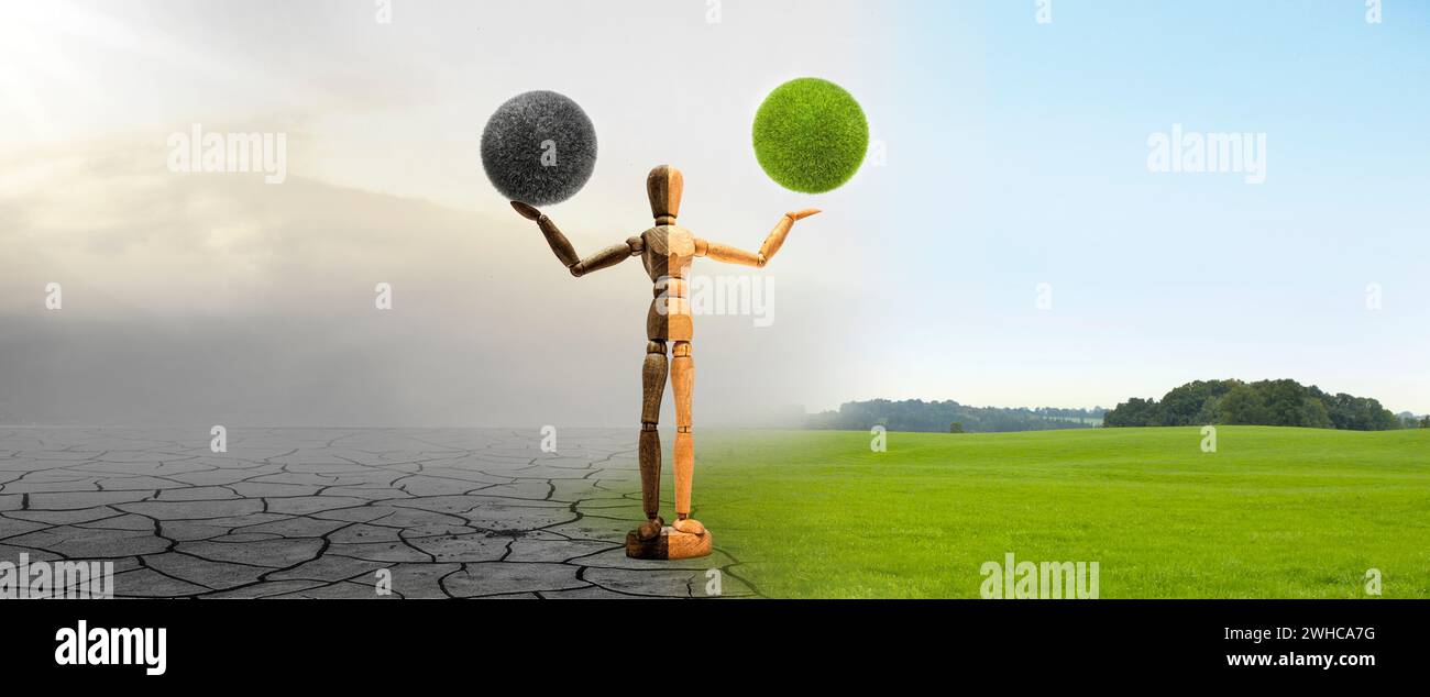 Holzfigur mit grauem und grünem Grasball im Klimawandel Stockfoto