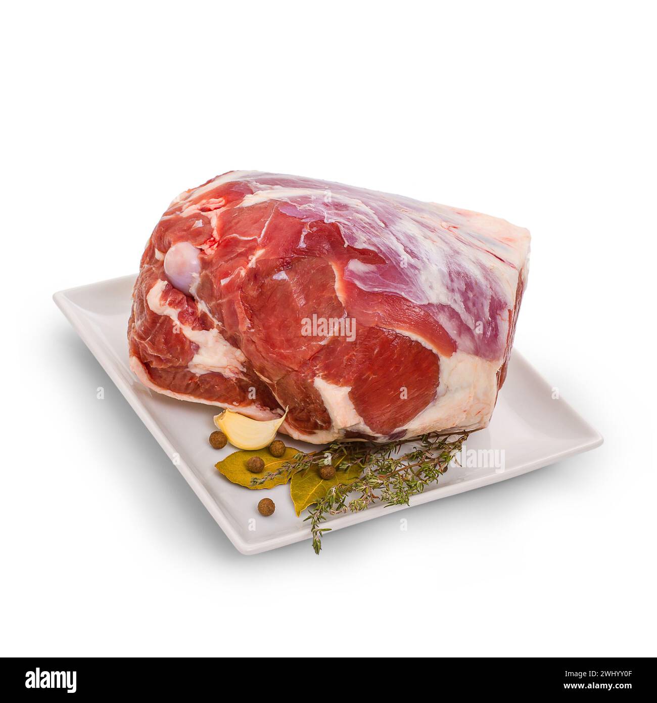 Gefrorene Lammkeule mit Knochen und Gewürzen Stockfoto