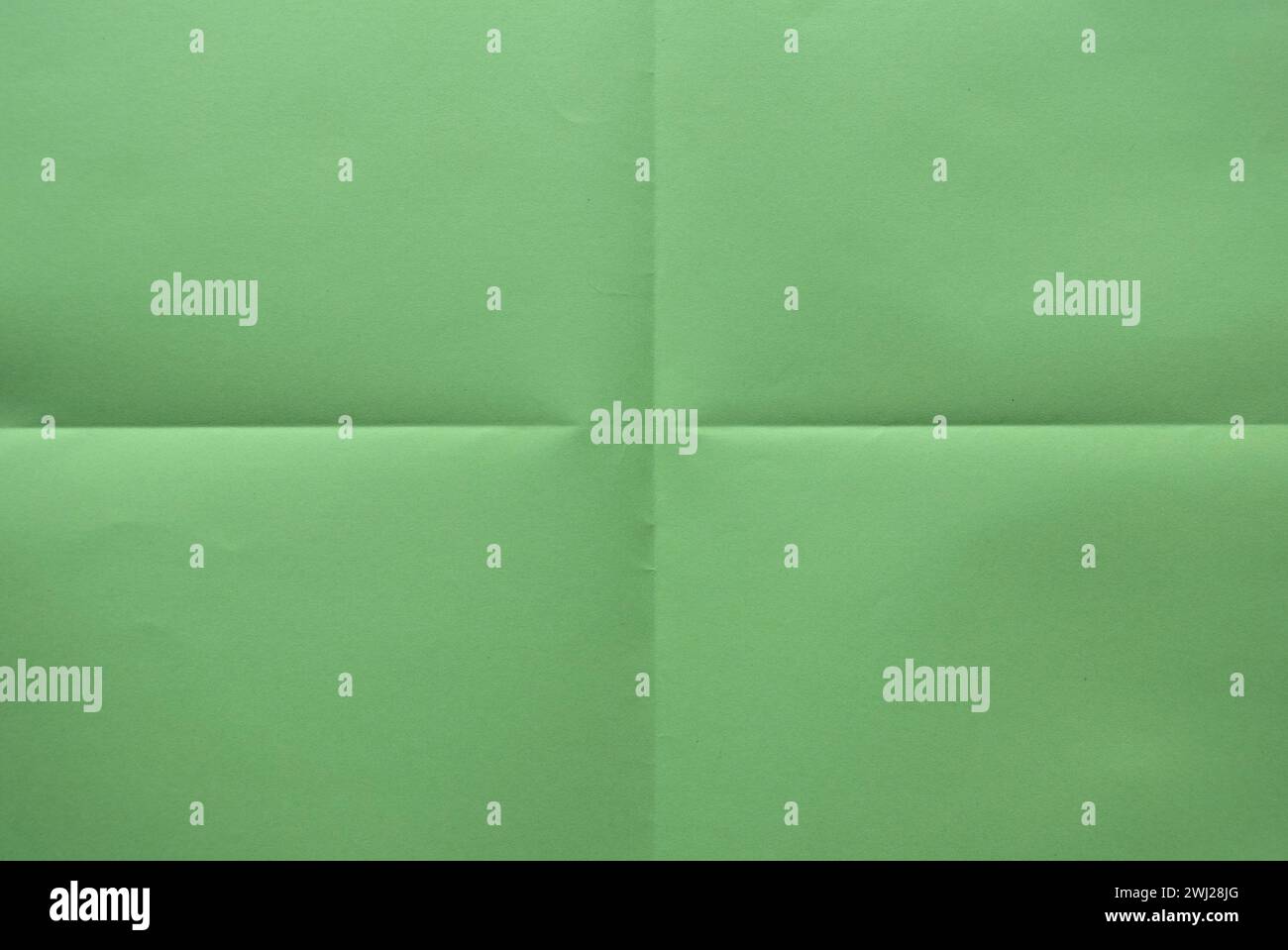 Gefaltetes grünes Farbpapier für den Hintergrund. Stockfoto