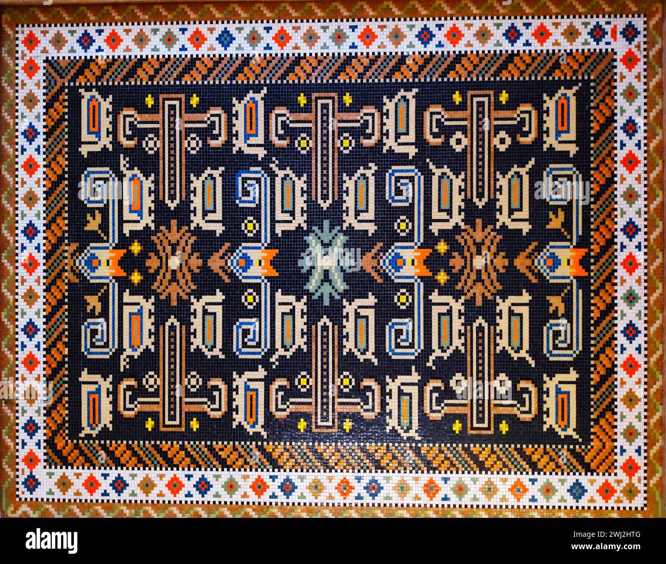 Teppichstruktur, Abstraktes Ornament. Farbenfroher Orientalischer Mosaikteppich Mit Traditionellem Ornament. Gemusterter Teppich. Nahansicht Des Handgefertigten Gewebten Teppichs. Stockfoto