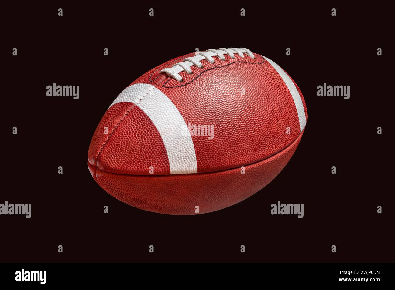 College-Style Lederfußball isoliert auf schwarzem Hintergrund Stockfoto