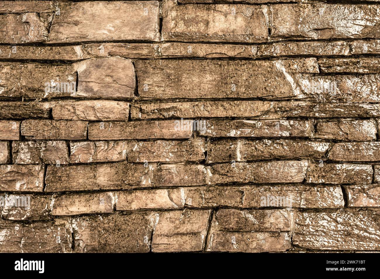 Steinstruktur. Beigefarbener Hintergrund zeigt raue Textur Steinmauerwerk Muster, rustikale Eleganz. Komplizierte Details und Erdtöne, zeitloser Rücken Stockfoto