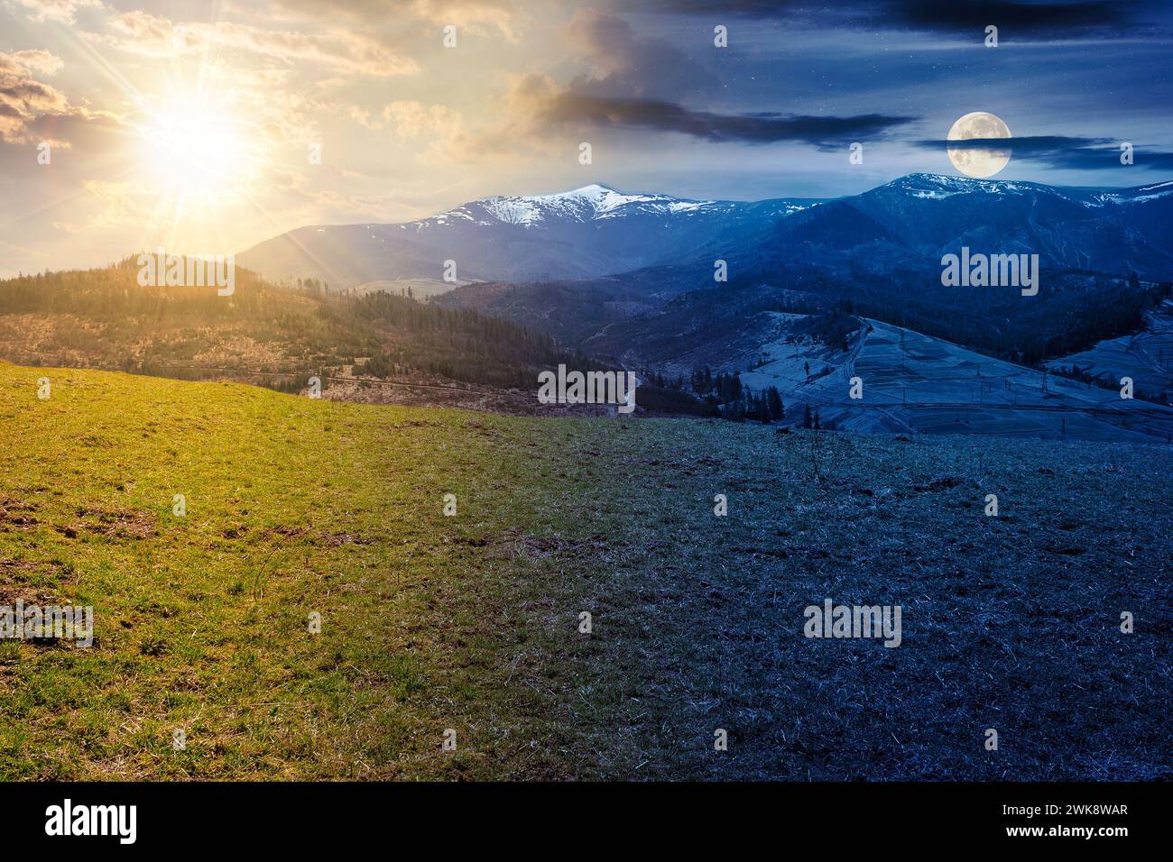 karpaten ländliche Landschaft im Frühling. Grasbewachsene Wiese auf dem Bergberg. Schneebedeckter Berg in der Ferne. Tag und Nacht ändern sich im Frühling Stockfoto