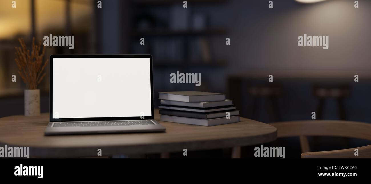 Ein Laptop-Modell mit weißem Bildschirm und Bücher auf einem Tisch in einem modernen dunklen Raum. Arbeitsbereich mit schlechten Lichtverhältnissen. Nahaufnahme. 3D-Rendering, 3D-Illustration Stockfoto