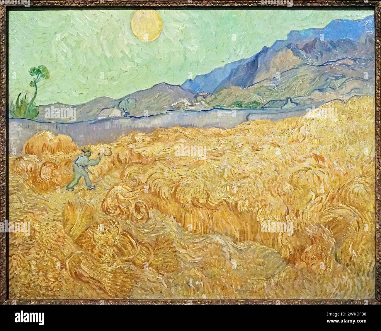 Wheatfield mit einem Reaper (1889) von Vincent van Gogh (1853–1890) Stockfoto