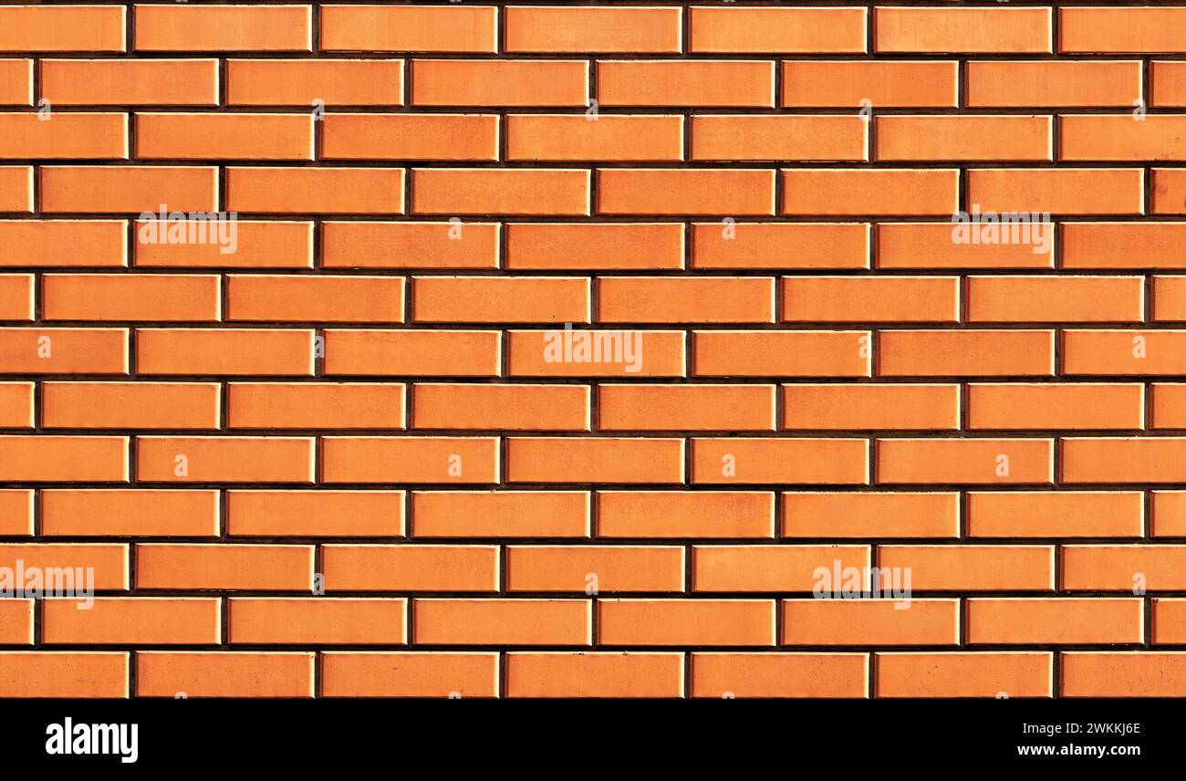 Ziegelwandstruktur. Wand aus neuen glatten Ziegeln. Stockfoto