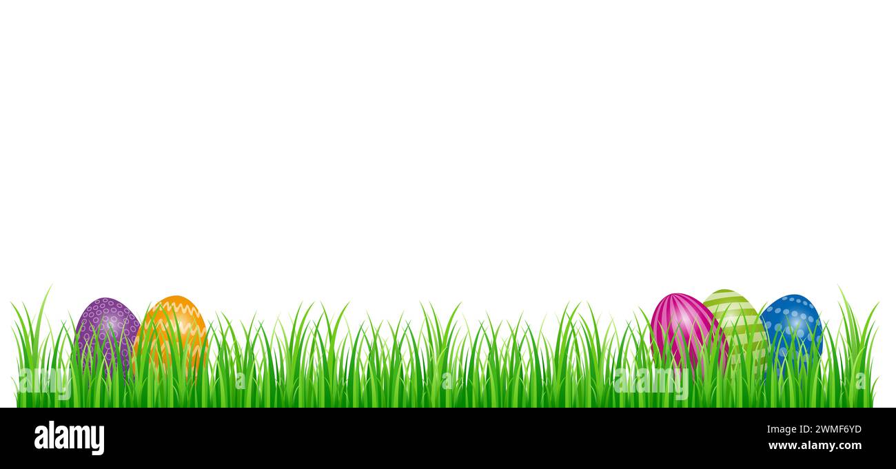 Ostereier versteckt im grünen Gras. Farbige Ostereier, auf einem Stück Rasen angeordnet. Symbol für eine Eierjagd, eine Schatzjagd zu Ostern. Stockfoto