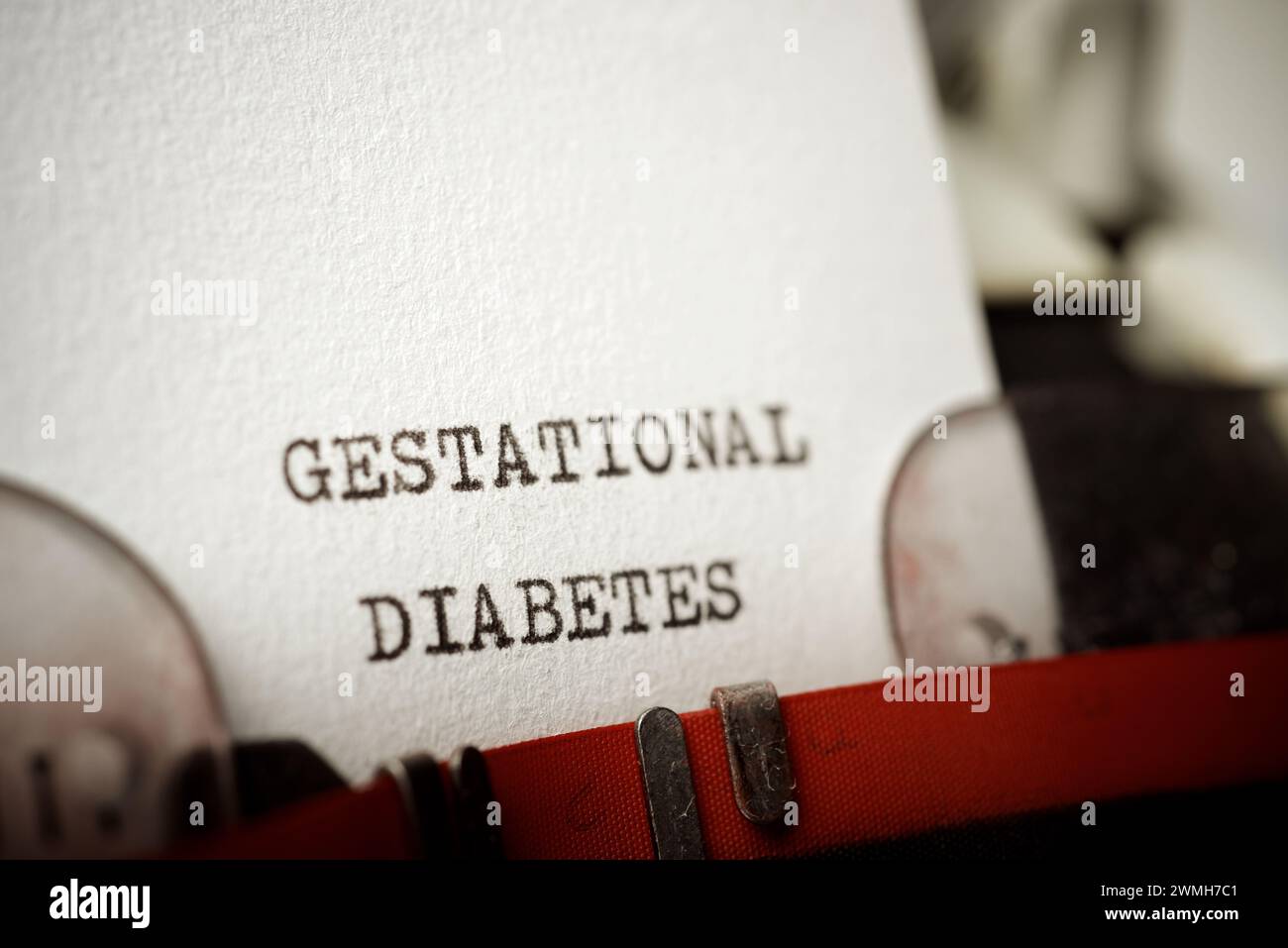 Text für Schwangerschaftsdiabetes, geschrieben mit einer Schreibmaschine. Stockfoto