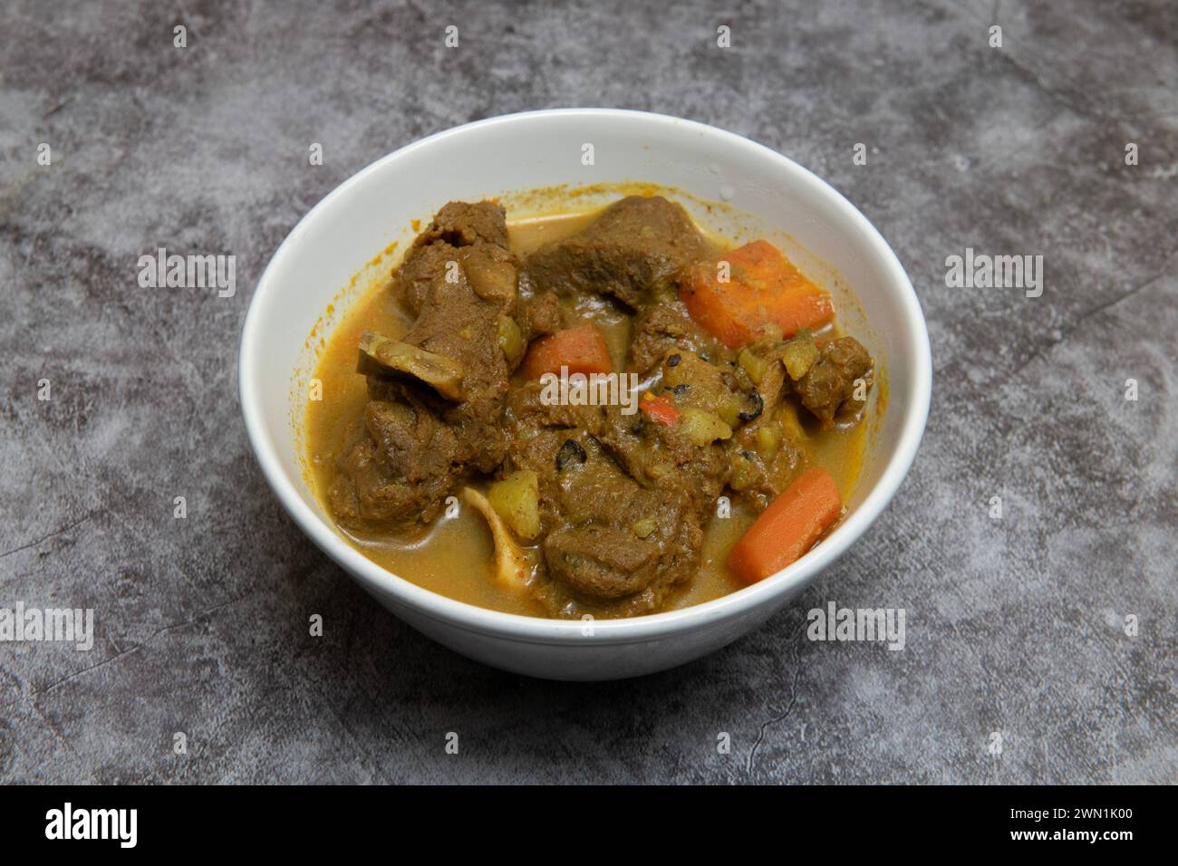 Karibisches Essen. Curryziege Stockfoto
