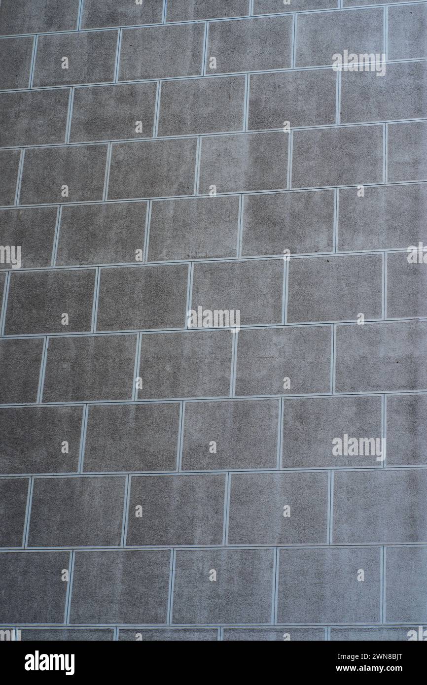Urbane Kontraste. Hintergrund der Zementwand. Stockfoto