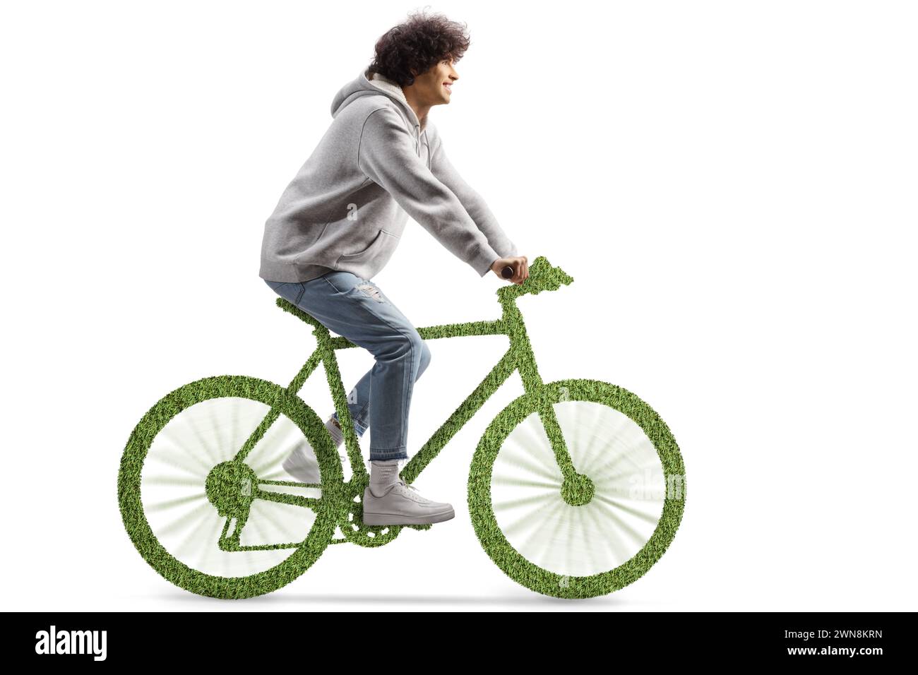 Ein Typ, der ein grünes umweltfreundliches Fahrrad fährt, isoliert auf weißem Hintergrund Stockfoto
