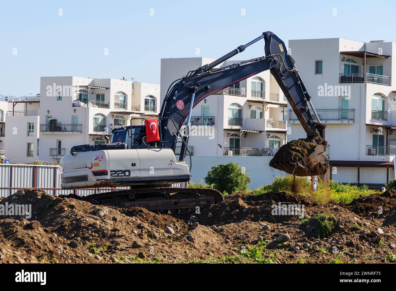 Bagger Graben von Boden auf einer Baustelle Stockfoto