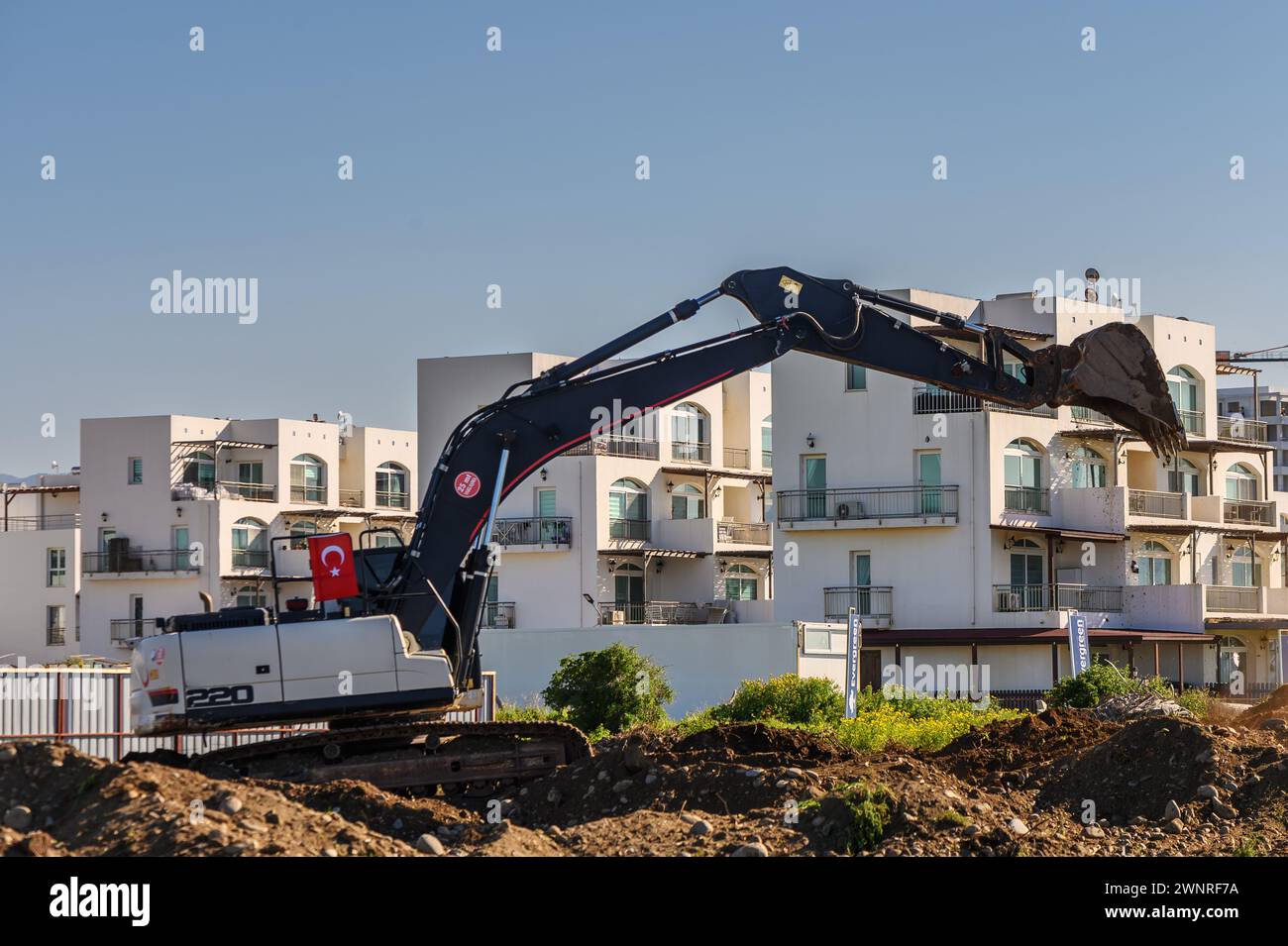 Bagger Graben von Boden auf einer Baustelle 1 Stockfoto