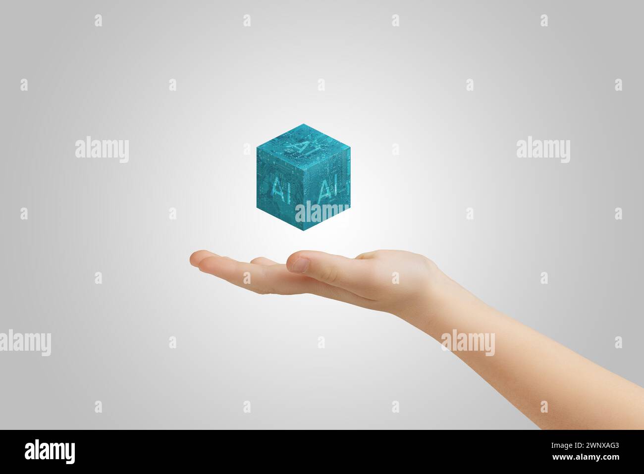 Hand mit schwebendem Cube mit KI-Text, der die Fortschritte der künstlichen Intelligenz veranschaulicht Stockfoto