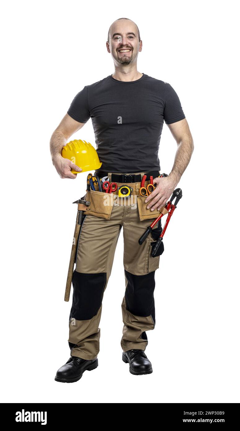 Fröhlicher Bauarbeiter in lässiger Kleidung mit gelbem Schutzhelm Stockfoto