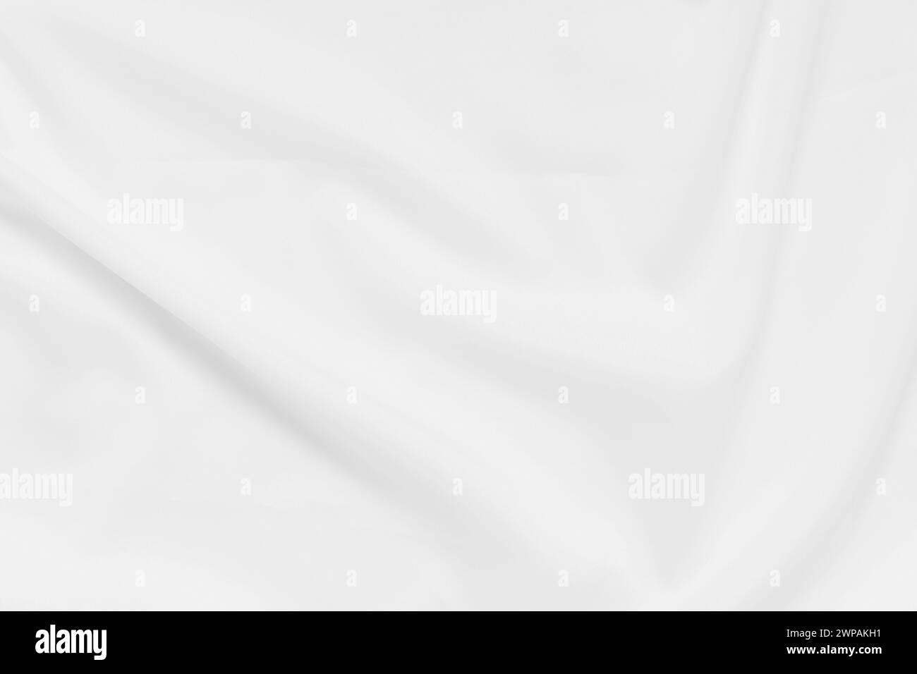 Abstrakte und weiche Fokuswelle mit weißem Stoffhintergrund, weißer Textur und Details Stockfoto