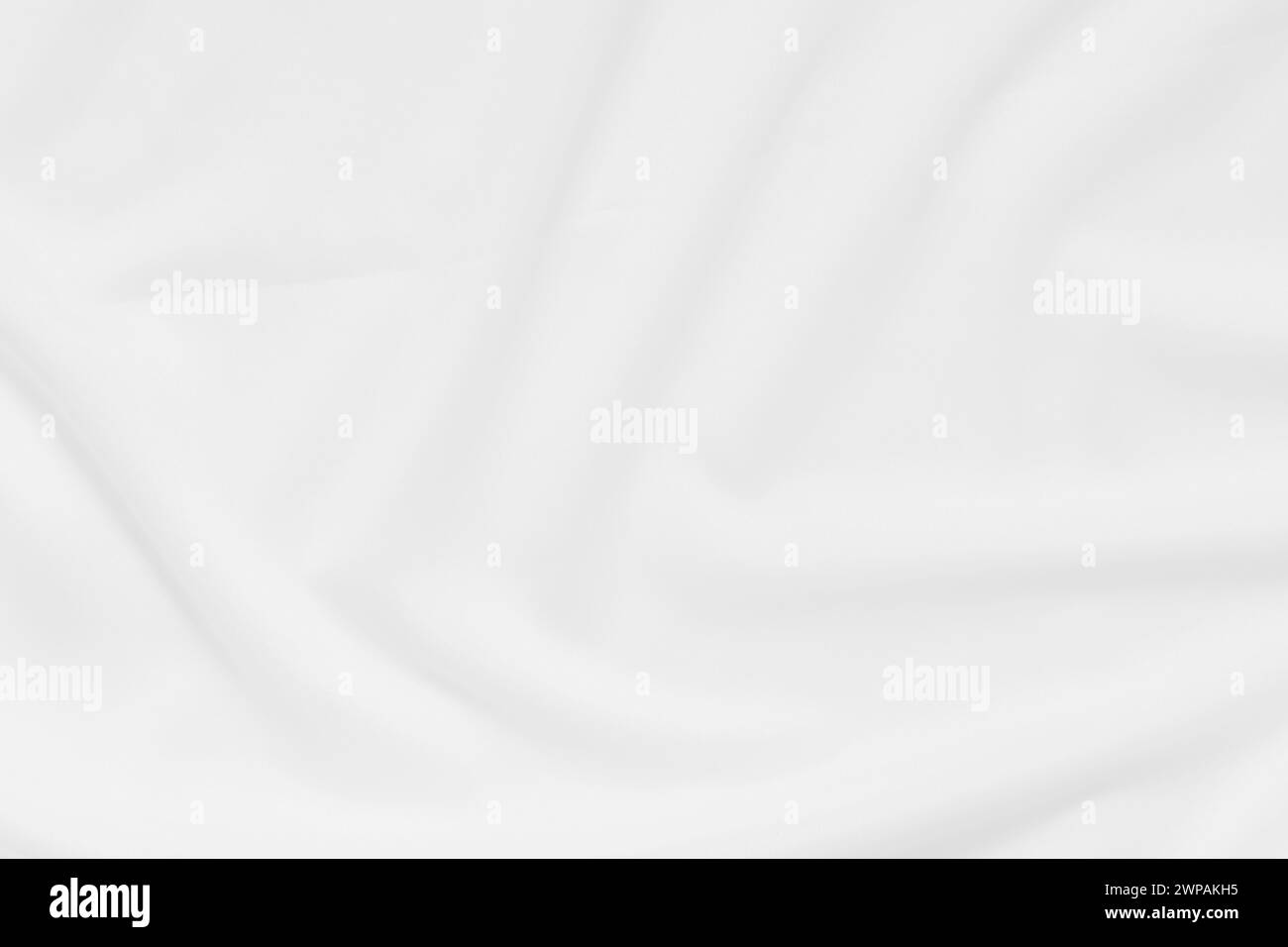 Abstrakte und weiche Fokuswelle mit weißem Stoffhintergrund, weißer Textur und Details Stockfoto