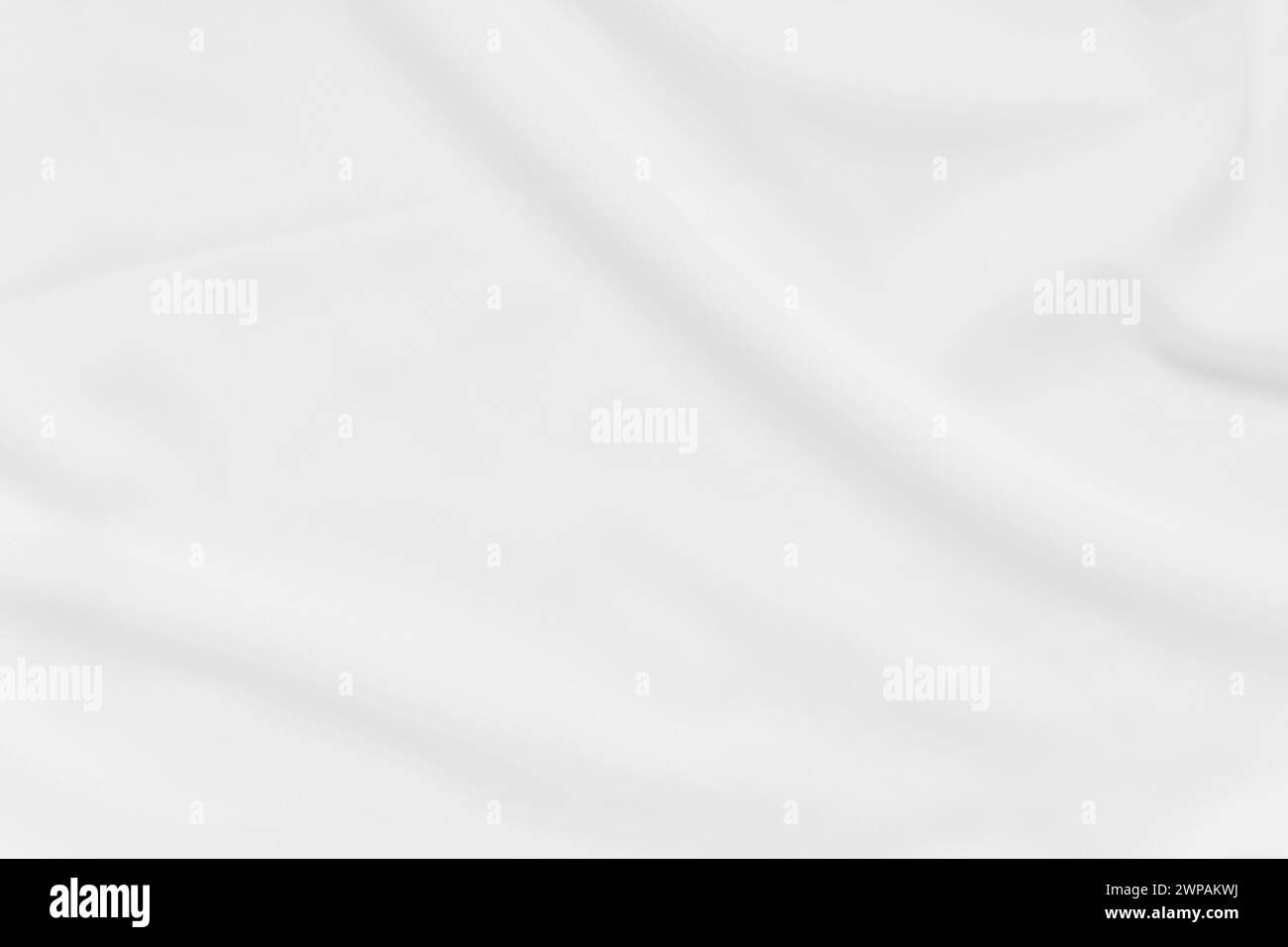 Abstrakte und weiche Fokuswelle mit weißem Stoffhintergrund, weißer Textur und Details Stockfoto