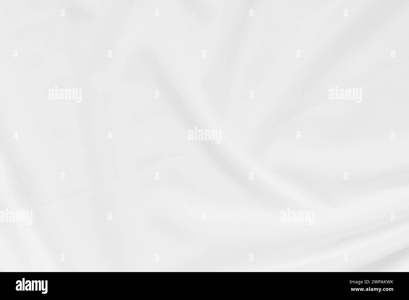 Abstrakte und weiche Fokuswelle mit weißem Stoffhintergrund, weißer Textur und Details Stockfoto