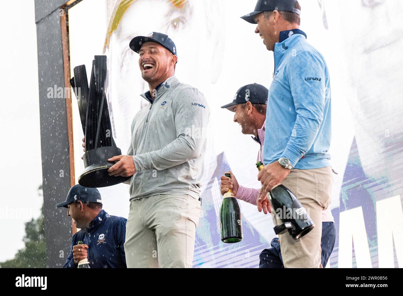 Anirban Lahiri, Captain Bryson DeChambeau, Charles Howel III and Paul Casey of Crushers GC celebrate with the Team Champion Trophy during the trophy ceremony after the final round of LIV Golf Hong Kong at the Hong Kong Golf Club Fanling on Sunday, March 10, 2024 in Fanling, Hong Kong. (Photo by Montana Pritchard/LIV Golf via AP) Stockfoto