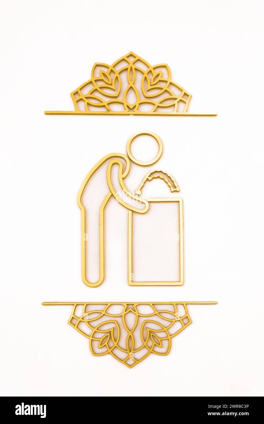 Ein Schild mit der Aufschrift Clean Your Hands vor dem Eingang zu einer Moschee in den VAE. Hygienekonzept. Waschen Sie sich die Hände. Niemand Stockfoto