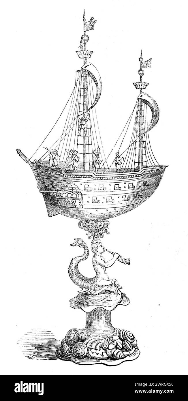 The Loan Collection, South-Kensington, 1862. "Silbergoldener nef; der Rumpf mit zwei Kanonen; das Deck, das als Decke abhebt, ist mit zwei Masten und Segeln ausgerüstet; auf ihm sind Musketiere und Offiziere, zwei Seeleute in der Takelage; auf dem Vorsegel ist ein Wappen, Party per blass; dexter, das Zeichen des Kaufmanns von Valentine Jeger, mit den Initialen V. J. in Chief, die ein Horn aufspießen; Wappen, ein Horn. Über dem Wappen steht die Inschrift I „Valentin Ieger, A&#xb0; 1661“. Das Schiff wird von einem Meermann gestützt, der eine Muschel bläst, auf einem ovalen Ständer aus geprägten Muscheln. Höhe, Stockfoto