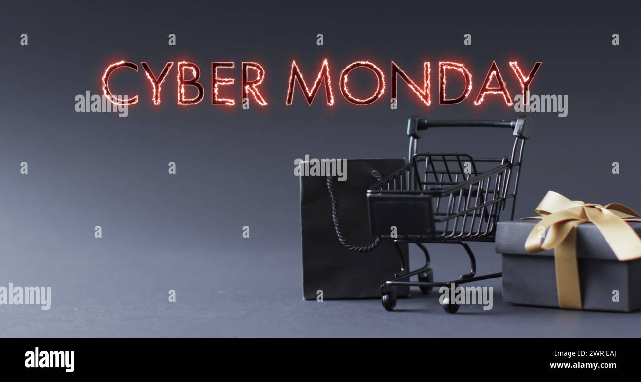 Bild: Text am Cyber monday über Einkaufswagen und Geschenken Stockfoto