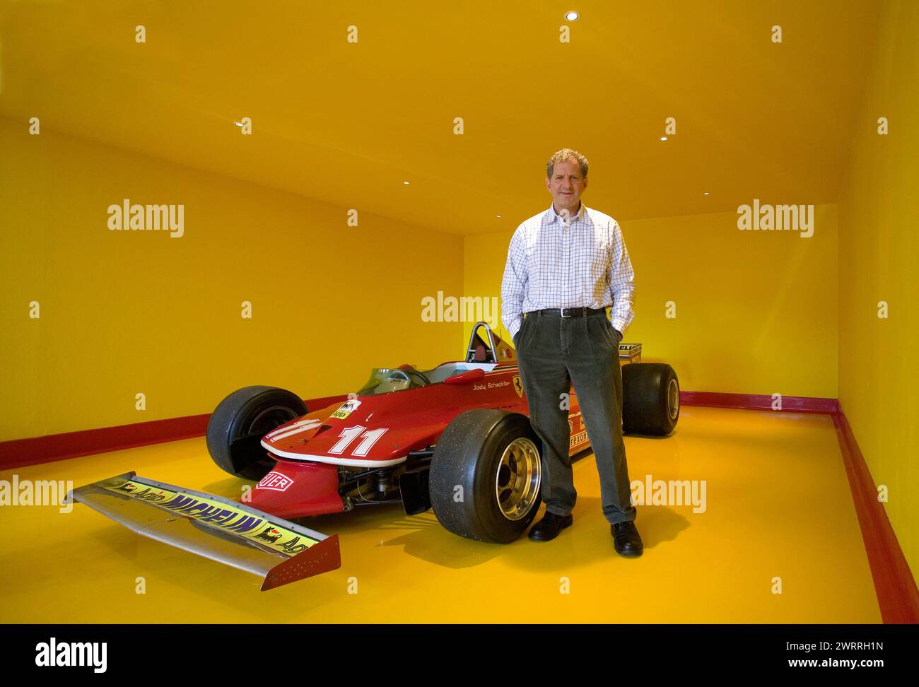 Jody Scheckter in seiner Garage mit seinem Ferrari 312 T4 von 1979 wurde er F1-Weltmeister. Stockfoto