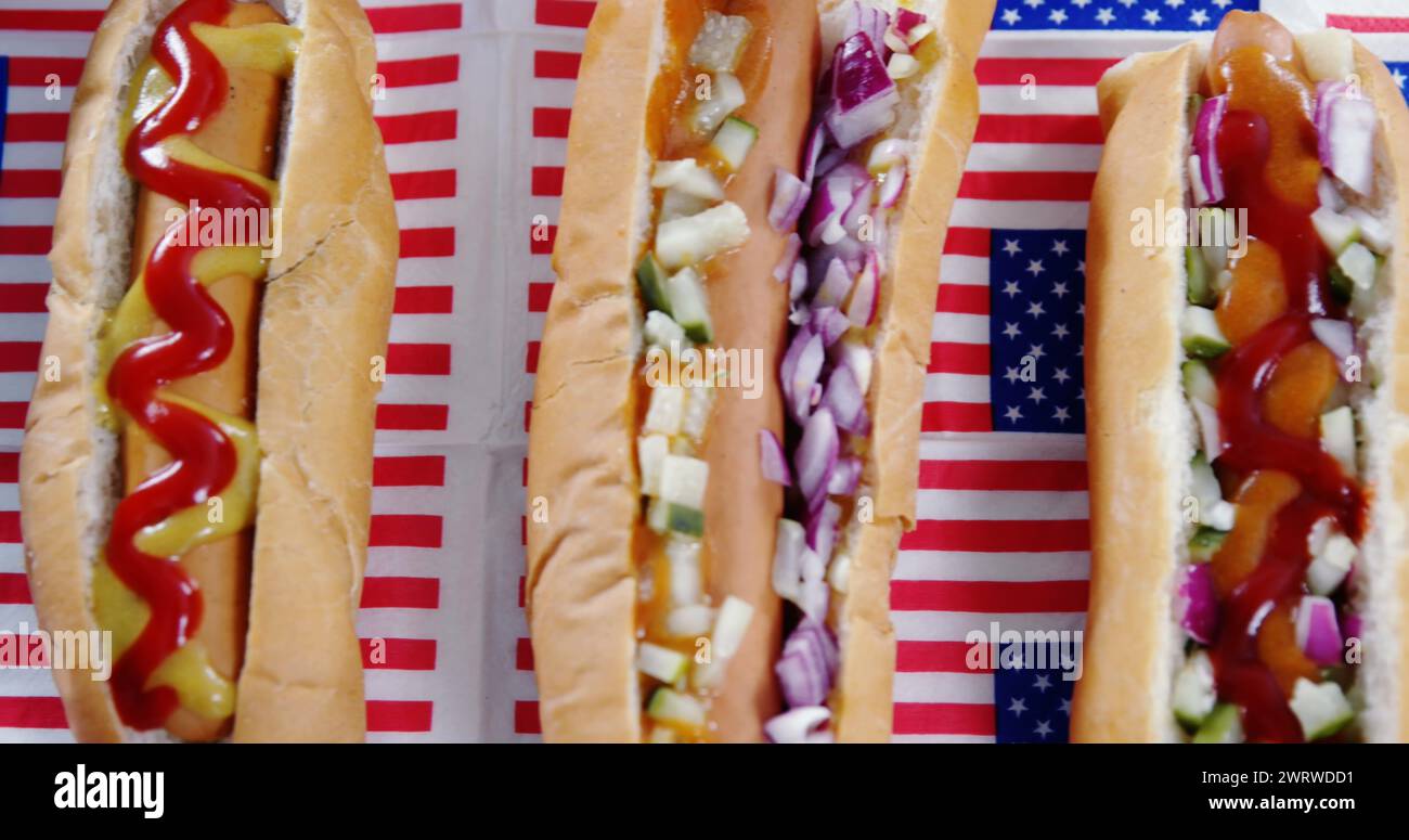 Bild von weißen und roten Streifen und menschlicher Silhouette über Hot Dogs Stockfoto