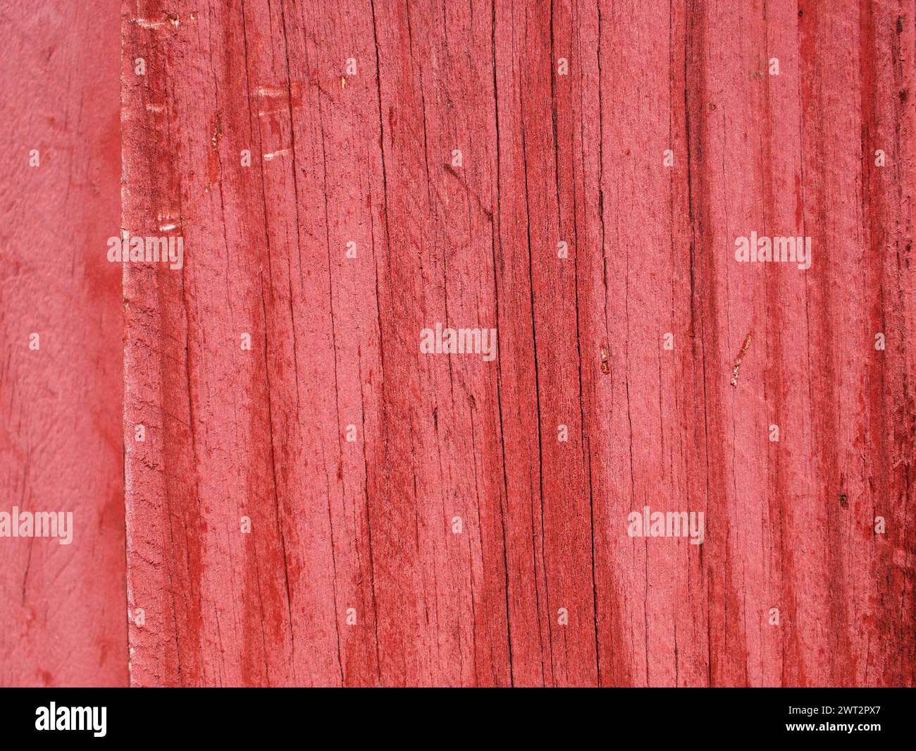 Alte rote Holzstruktur oder Hintergrund. Veralteter Zaun. Stockfoto