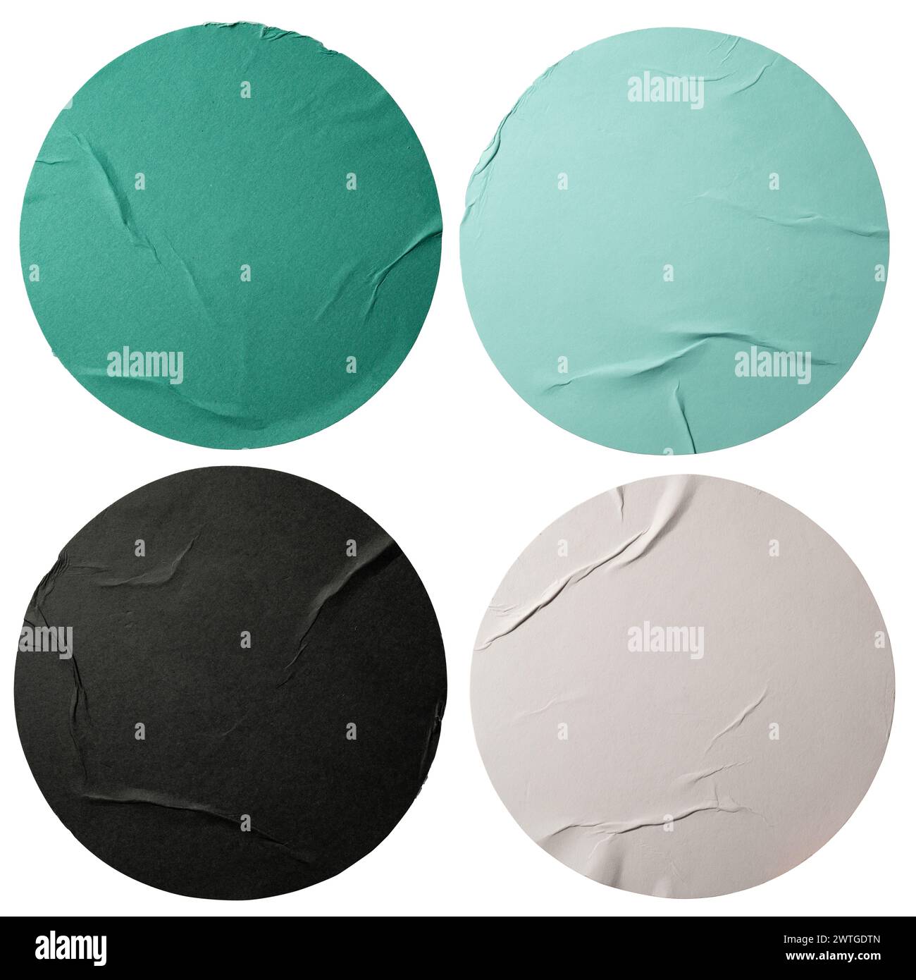 Runde grüne, schwarze und weiße Papieraufkleber isoliert auf weißem Hintergrund mit Beschneidungspfad Stockfoto