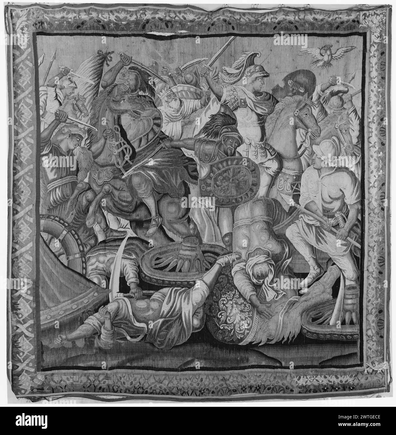 Schlacht von Gaugemela. Le Brun, Charles (Französisch, 1619-1690) (entworfen nach) [Maler] ca. 1680 Gobelin Abmessungen: H 9'5' x B 9'5' 5' Gobelin Materialien/Techniken: Unbekannt Kultur: Französisches Weberzentrum: Aubusson Besitz Geschichte: French & Co. Gekauft von Mr. Guy Howard, erhalten am 1.1955; verkauft an S. A. Selma 6.12.1962. Schlachtszene mit Alexander auf einem Pferd und bereit, mit dem Schwert zu schlagen, während er einen Vogel sieht, der neben ihm fliegt; Boden übersät mit gefallenen Soldaten im Vordergrund und gekröntem alten Mann, der einen Olivenzweig hält (?) Im Hintergrund (Mitte) (BRD) halbkreisförmiges Motiv überlagert Stockfoto