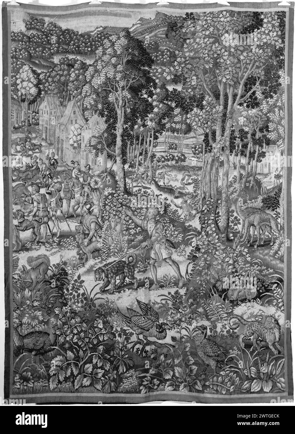Wildpark mit Jagdszene. Unbekannt ca. 1575-1625 Gobelin Abmessungen: H 8'3' x B 6'3' Gobelin Materialien/Techniken: Unbekannt Kultur: Flämisches Weberzentrum: Brüssel Eigentum Geschichte: Französisch & Co. Gekauft von Roy Foster, erhalten am 19.05.1965; verkauft an Botschafter Ortona (italienische Botschaft) 1967. Vögel und Leoparden (?) (Vordergrund); zentraler Jäger mit Hund an der Leine; andere Jäger neben Häusern links (Mittelboden); Hügel in der Ferne sichtbar Fragment eines Wildparks Wandteppich; Grenzen fehlen. French & Co. Stock Sheet im Archiv, H-482-A Stockfoto