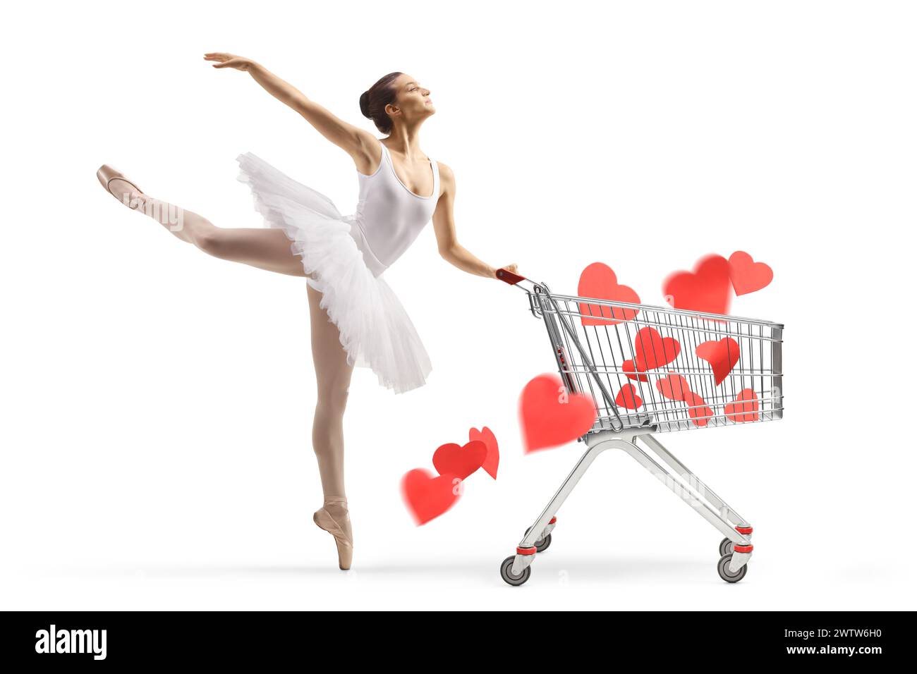 Profilaufnahme einer Ballerina in einem weißen Tutu-Kleid, das mit Herzen in einem Einkaufswagen auf weißem Hintergrund tanzt Stockfoto