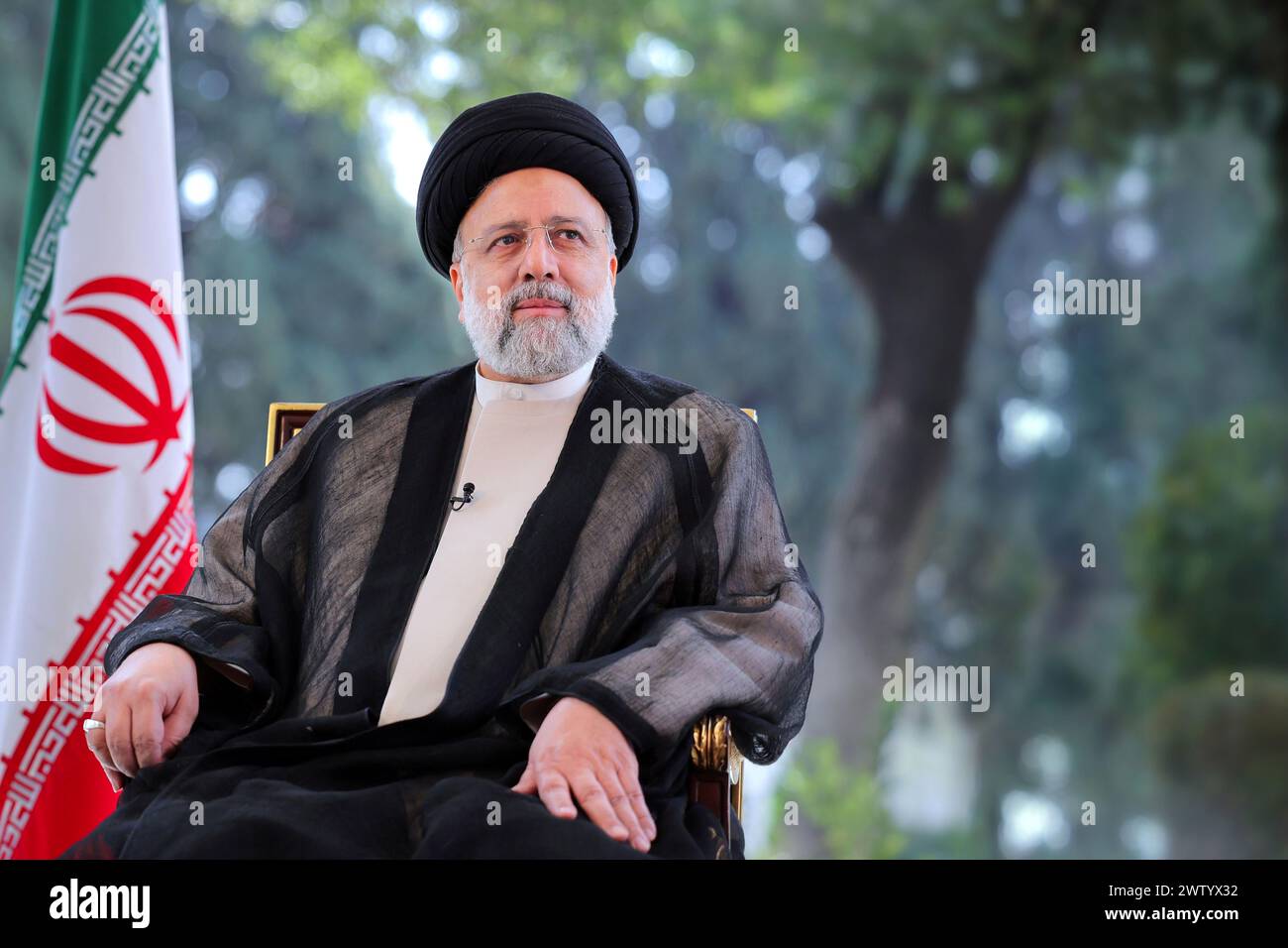 Teheran, Iran. März 2024. Der iranische Präsident Ebrahim Raisi wurde während seiner Fernsehansprache anlässlich des persischen Neujahrs (Nowruz) vorgestellt. Vermerk: -/iranischer Ratsvorsitz/dpa - ACHTUNG: Nur redaktionelle Verwendung und nur, wenn die oben erwähnte Verleihung in Full/dpa/Alamy Live News erwähnt wird Stockfoto