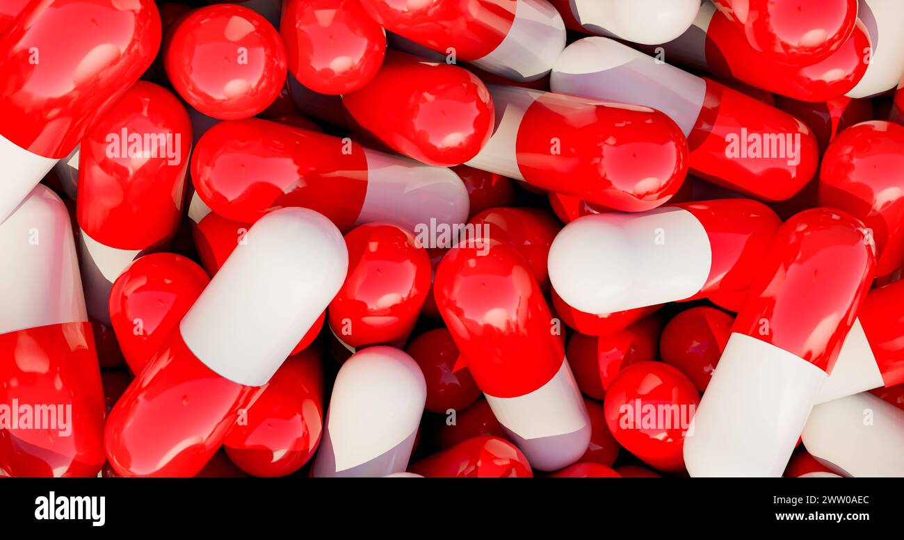 Rote Heilpillen in einer Kiste. Rote medizinische Pillen, Kapseln in einer Schachtel. Industrielle Herstellung von Medikamenten, Antibiotika oder anderen Medikamenten. Science025s04 Medical Stockfoto