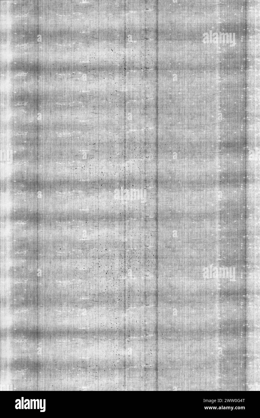 Einzigartiger Schwarzweiß-Ausdruck eines Laserdruckers, der eine fehlerhafte Tonerkassette mit auslaufendem Toner zeigt. Stockfoto